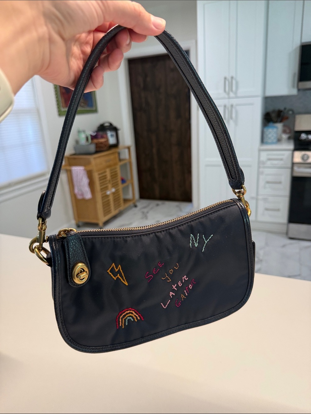 COACH navy blue nylon swinger bag